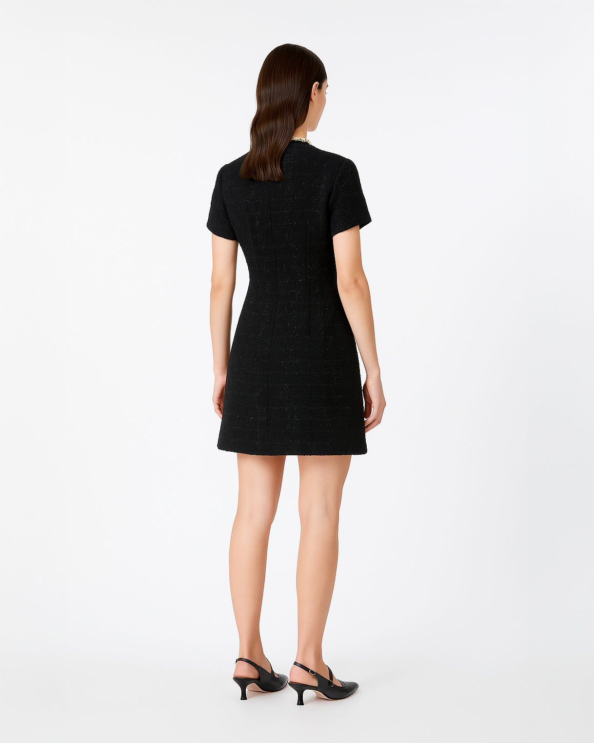 Back view of the Saint Rae Camille black tweed mini dress, featuring structured shoulders, tailored seams, and a modern A-line silhouette, an elegant short sleeve cocktail dress ideal for office wear or special occasions.